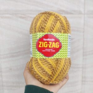 Hand holding Vardhman Zig-Zag knitting yarn.