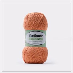 Orange Vardhman knitting yarn on white background.