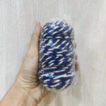 Hand holding a packaged blue and white rope.